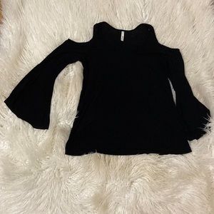 Elan black shirt with flared sleeves and peek a boo shoulder.